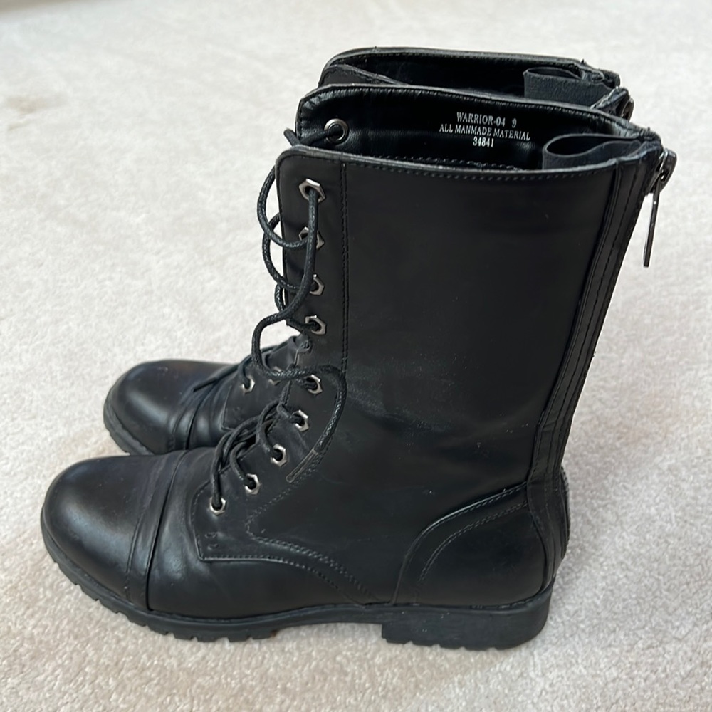 Black combat boots with zipper on back